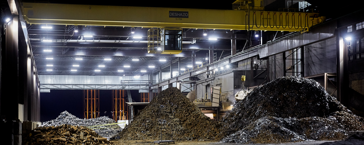 Nighttime view of well-lit scrap yard to support three shift operation 