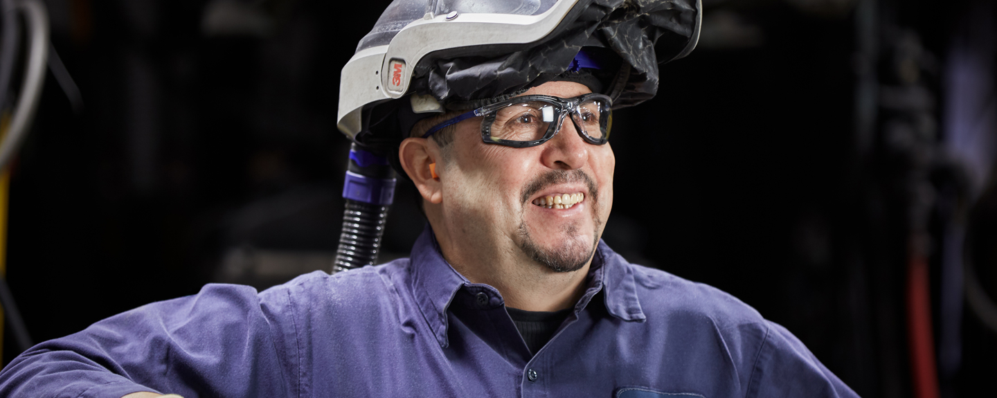 Color photo of Cast iron foundry operator smiling