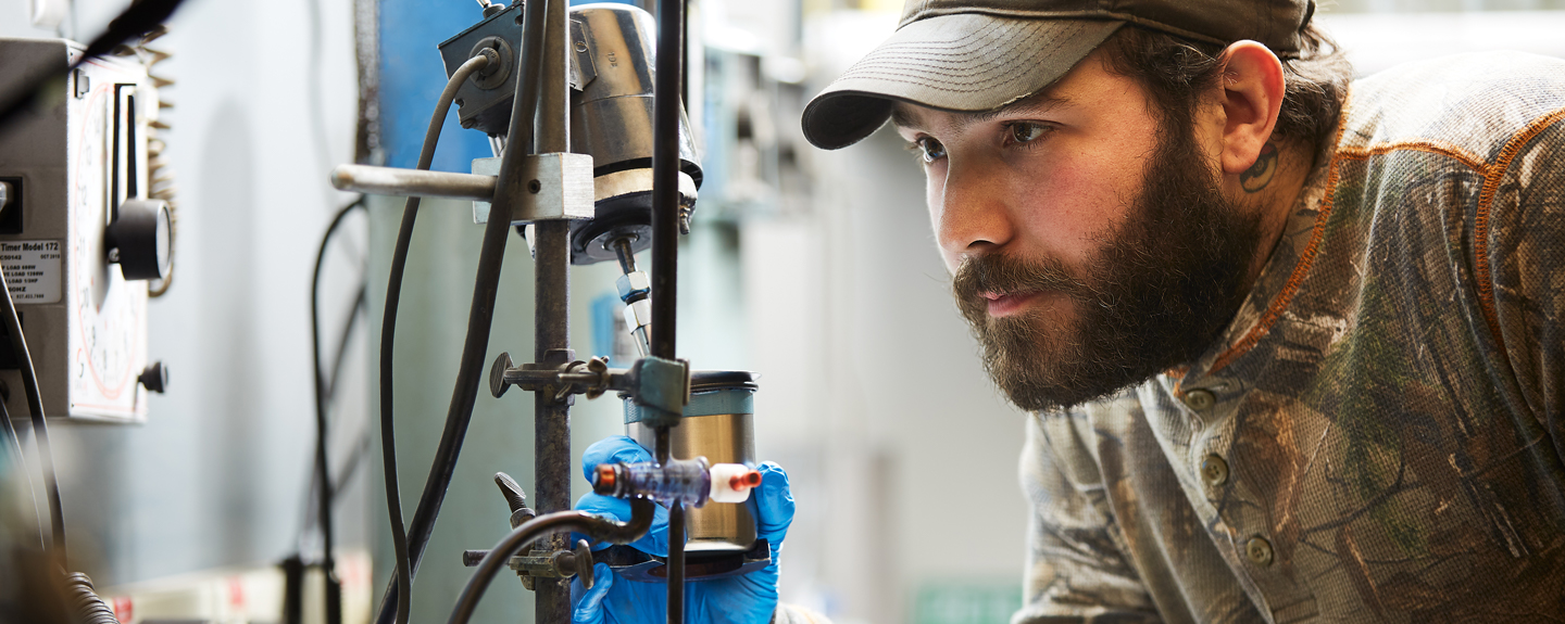 Foundry lab technician reviewing the green sand process to ensure quality output