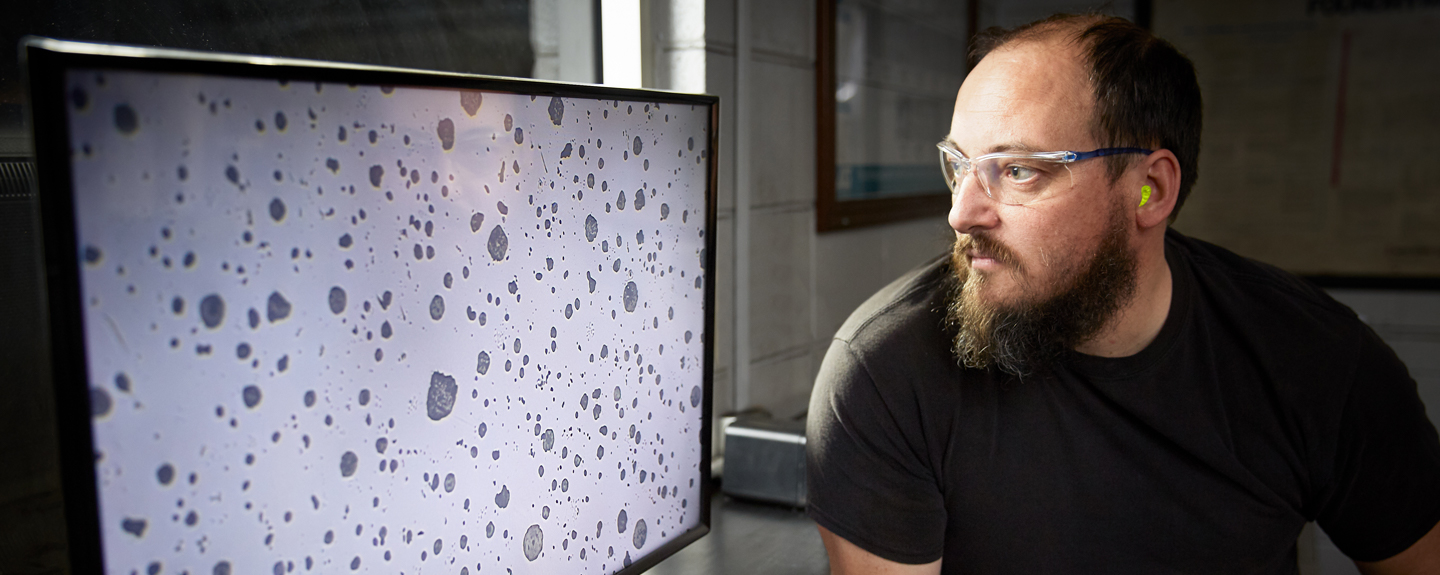 Cast Iron Metal Lab technicians reviewing test samples to verify the cast iron process is functioning properly 