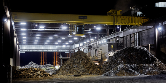 Nighttime view of well-lit scrap yard to support three shift operation 